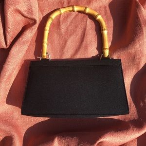Black purse with bamboo handle